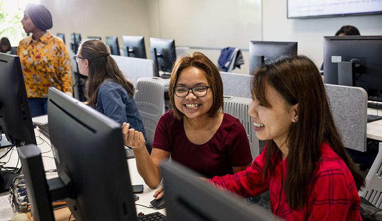 Young women in computer science class