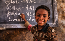 African young boy is learning Amharic language